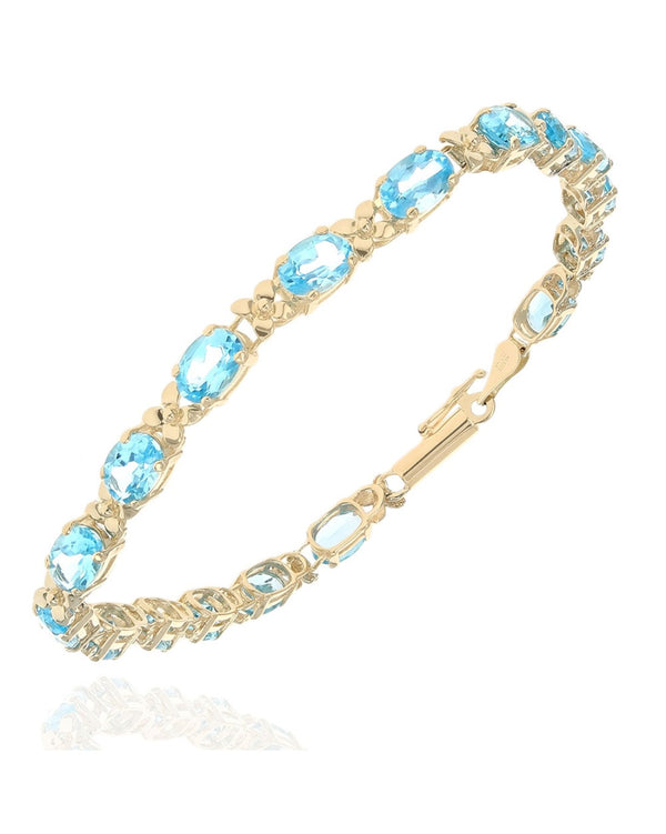 Alternating Swiss Blue Topaz and Flower Link Inline Bracelet in Yellow Gold