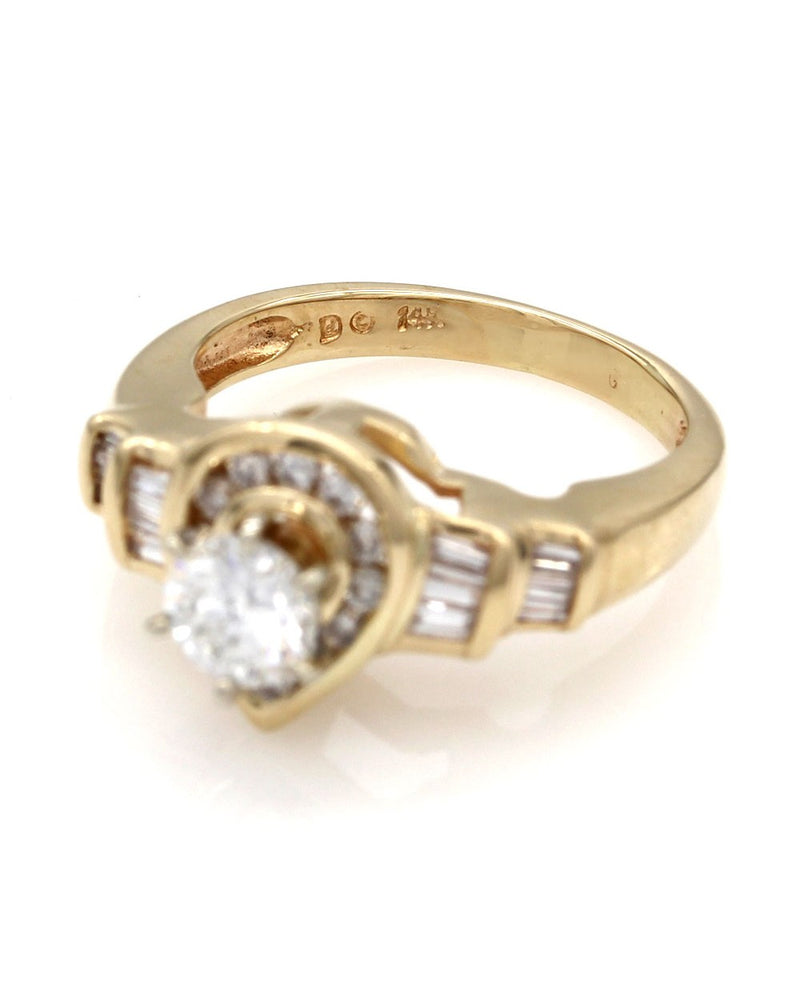 Round and Baguette Diamond Pear Shaped Ring in Gold