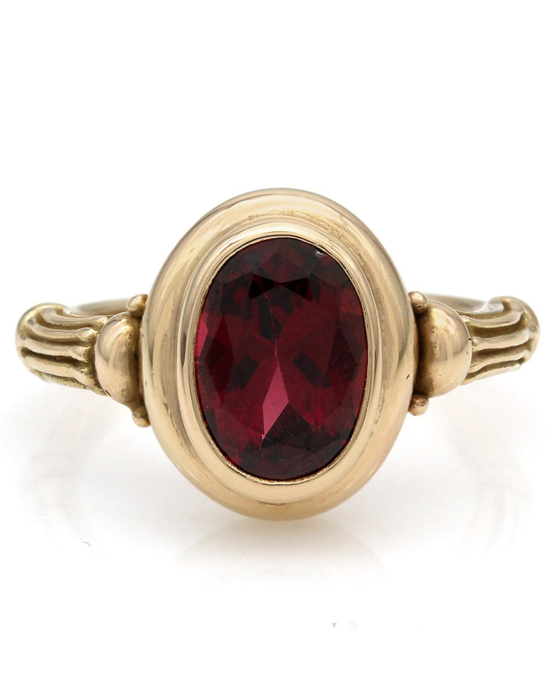 Oval Garnet Ring in Yellow Gold