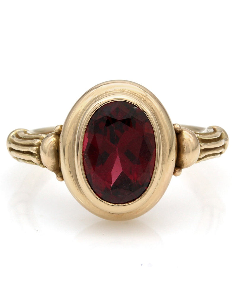Oval Garnet Ring in Yellow Gold