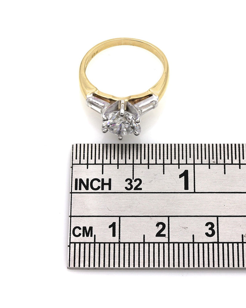 Round Diamond Solitaire Ring with Baguette Accents