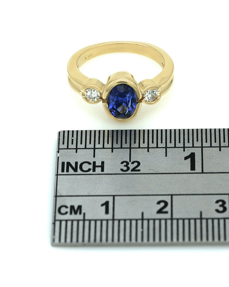 Blue Sapphire and Diamond Accent Ring in Yellow Gold