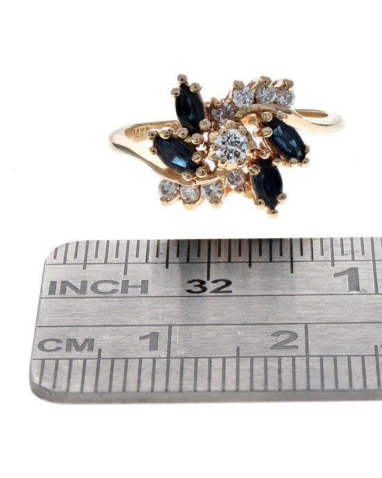 Dark Blue Sapphire and Diamond Bypass Ring in Yellow Gold