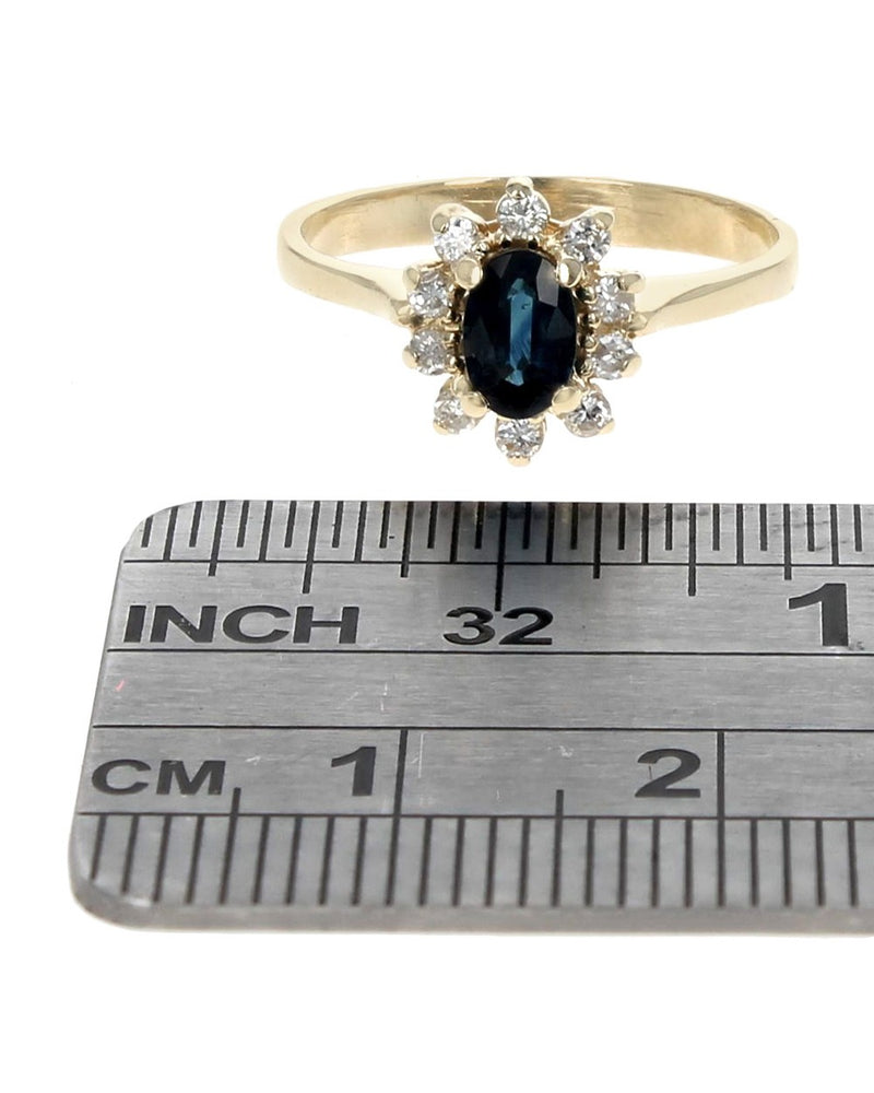 Blue Sapphire and Diamond Halo Ring in Yellow Gold